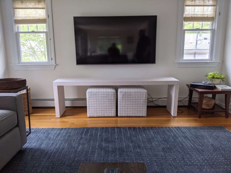 TV mounted on living room with in wall cord concealment.